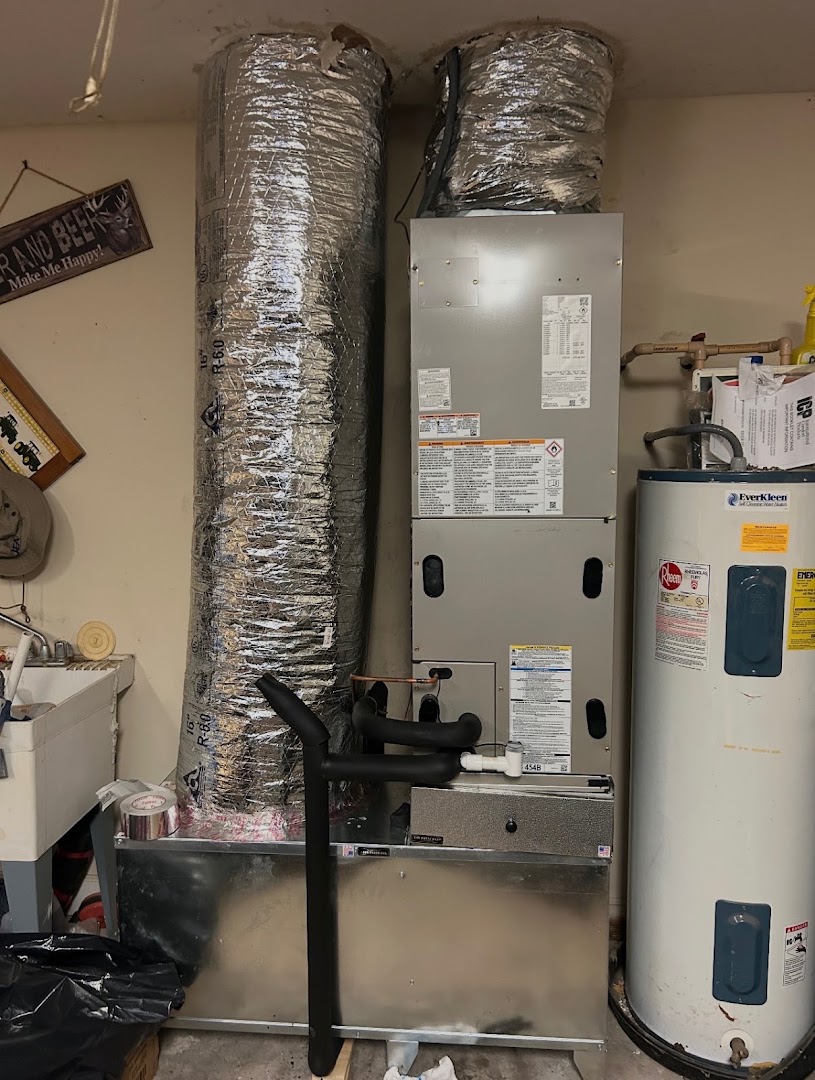 New air handler and ductwork installed in a garage
